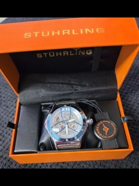 Stuhrling Silver Skeleton Dial Watch - Blue Accents
